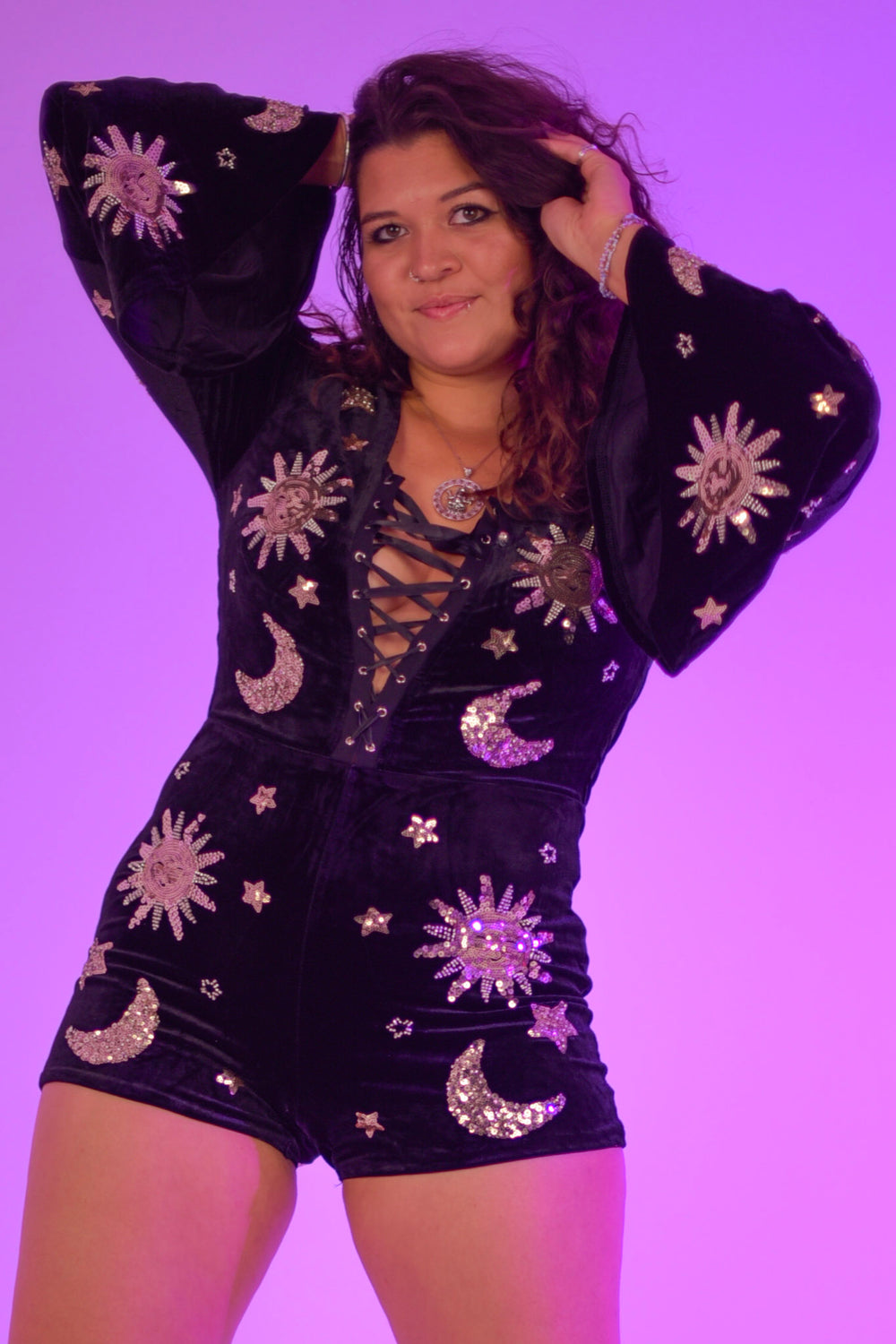 The Phase Playsuit in luxe velvet featuring zip back, flared sleeves, and shimmering celestial embellishments. Comfortable 4-way stretch fit.