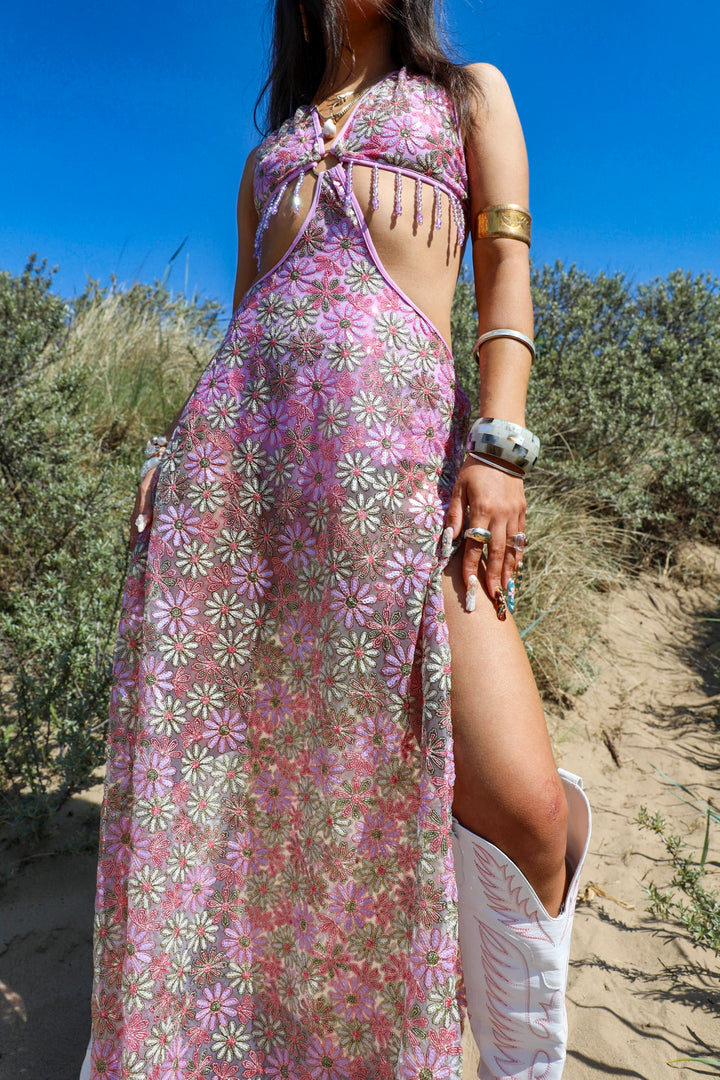 Close-up of Wildflower Maxi Dress with pink and green floral mesh, halter top, and leg slit, perfect for festival fashion lovers.