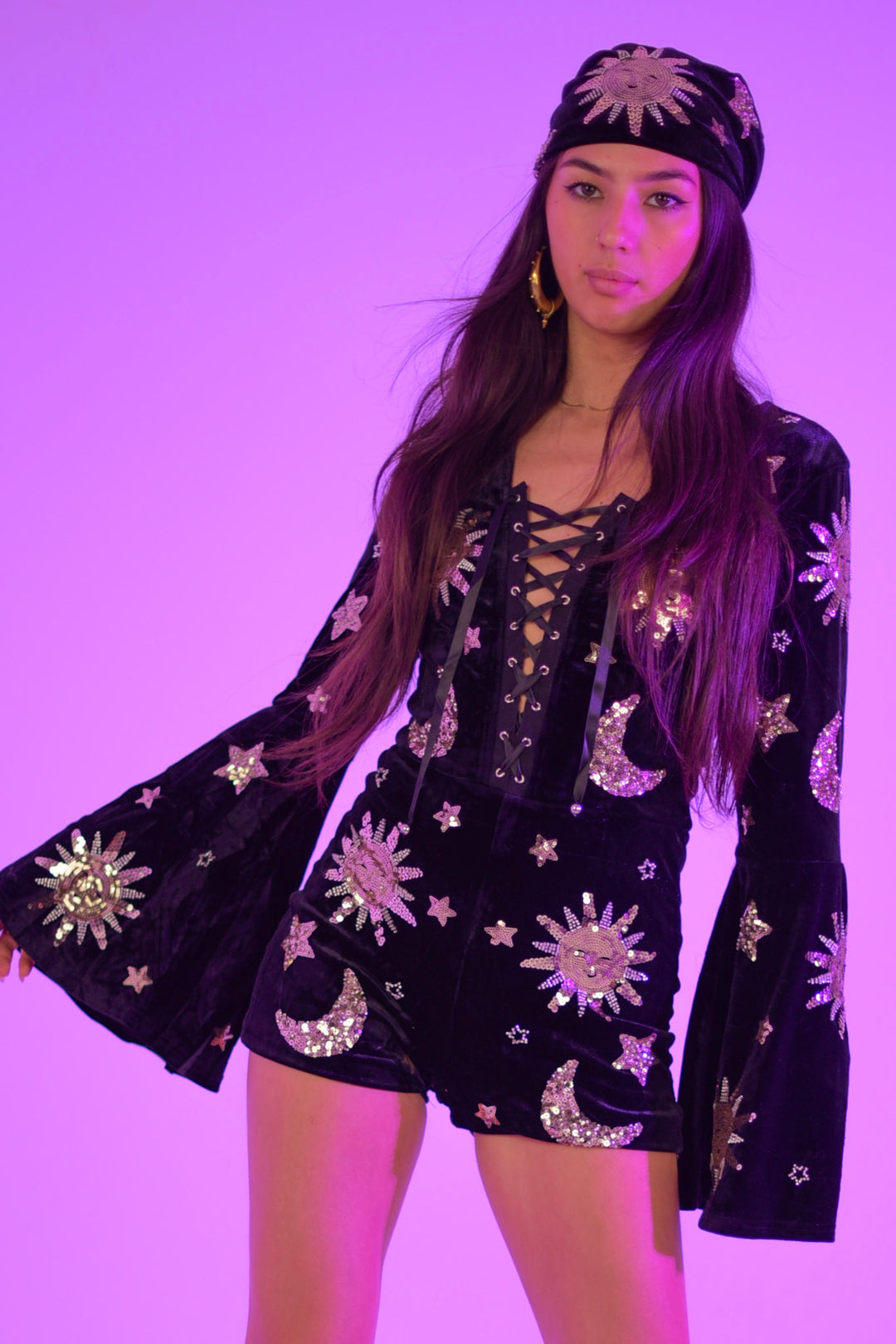 The Phase Playsuit - Stretch Velvet with lace-up front, bell sleeves, and celestial sequin design in sun and moon motifs. Ideal for statement outerwear.