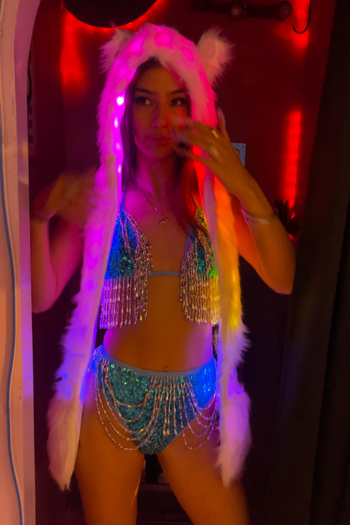 Afterglow LED Animal Hat Hood with purple and pink LED lights, paired with sequin rave outfit for festival-ready style.