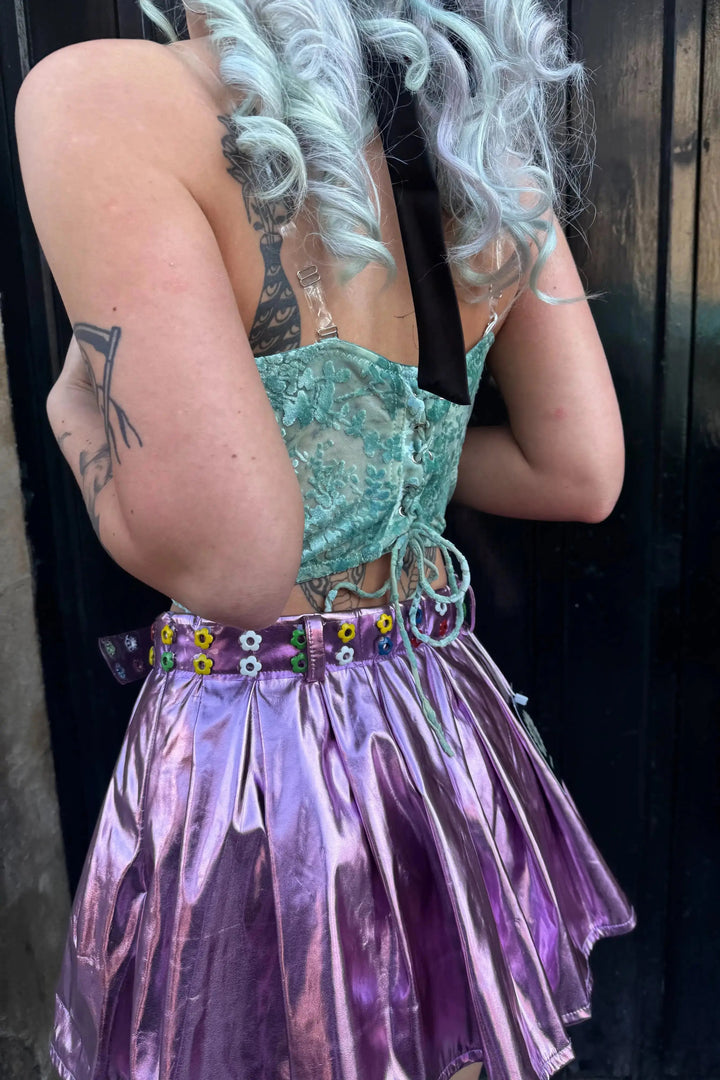 Close-up of Dixie Velvet Corset Top's lace-up back and sheer floral detailing, perfect for edgy festival and rave outfits.