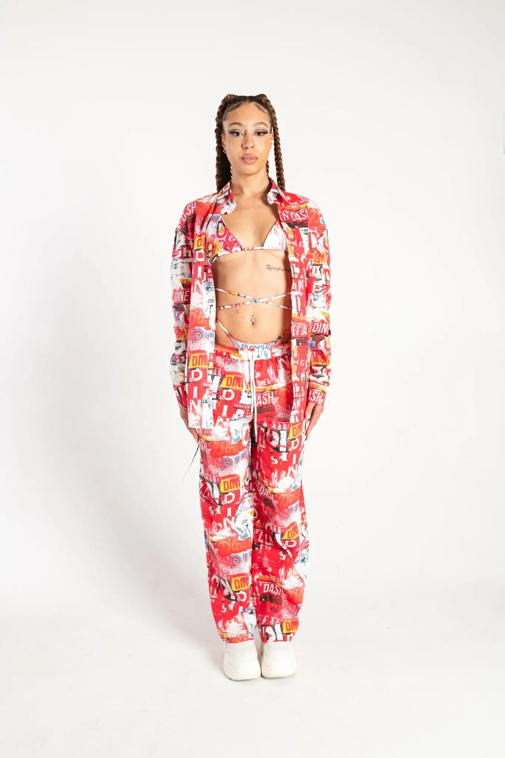 Front view of Dine and Dash Shirt with all-over red and white collage print, perfect for alternative rave and festival outfits.