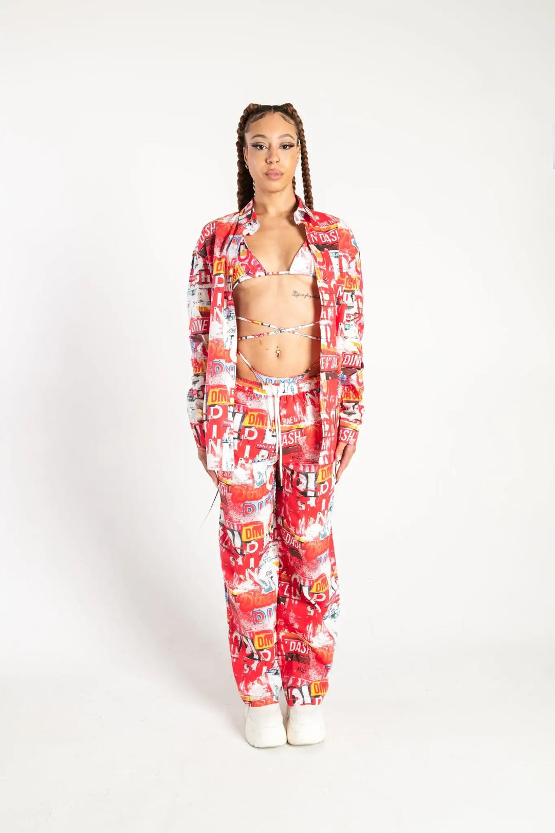 Front view of Dine and Dash Shirt with all-over red and white collage print, perfect for alternative rave and festival outfits.