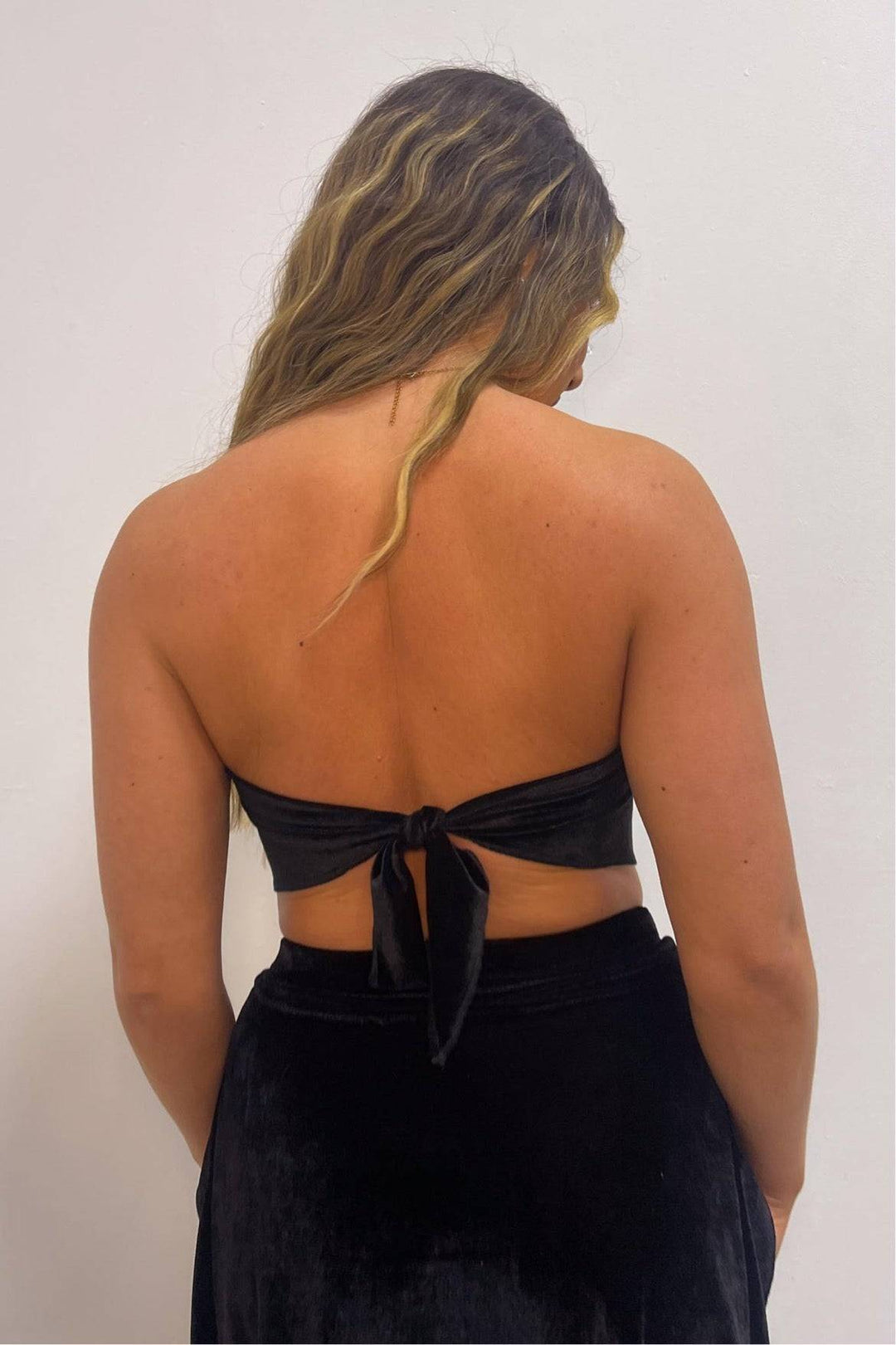 Back view of black velvet bandana top with tie closure