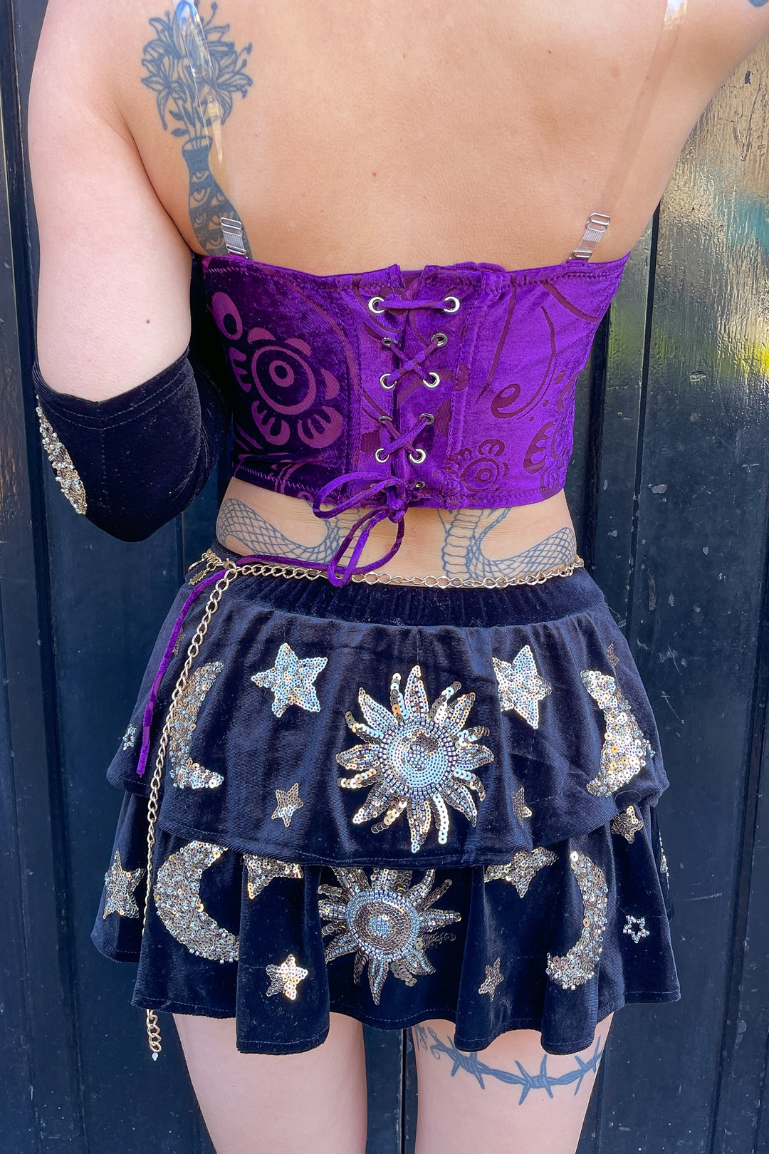 Back view of Phoebe Velvet Corset Top featuring lace-up closure in purple velvet. Ideal for bold rave and festival outfits.