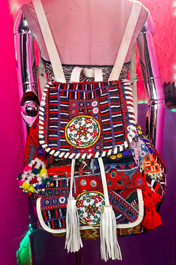 Wren Backpack with vibrant embroidered patterns, beaded details, and tassels, ideal for rave and festival fashion from Wild Thing.