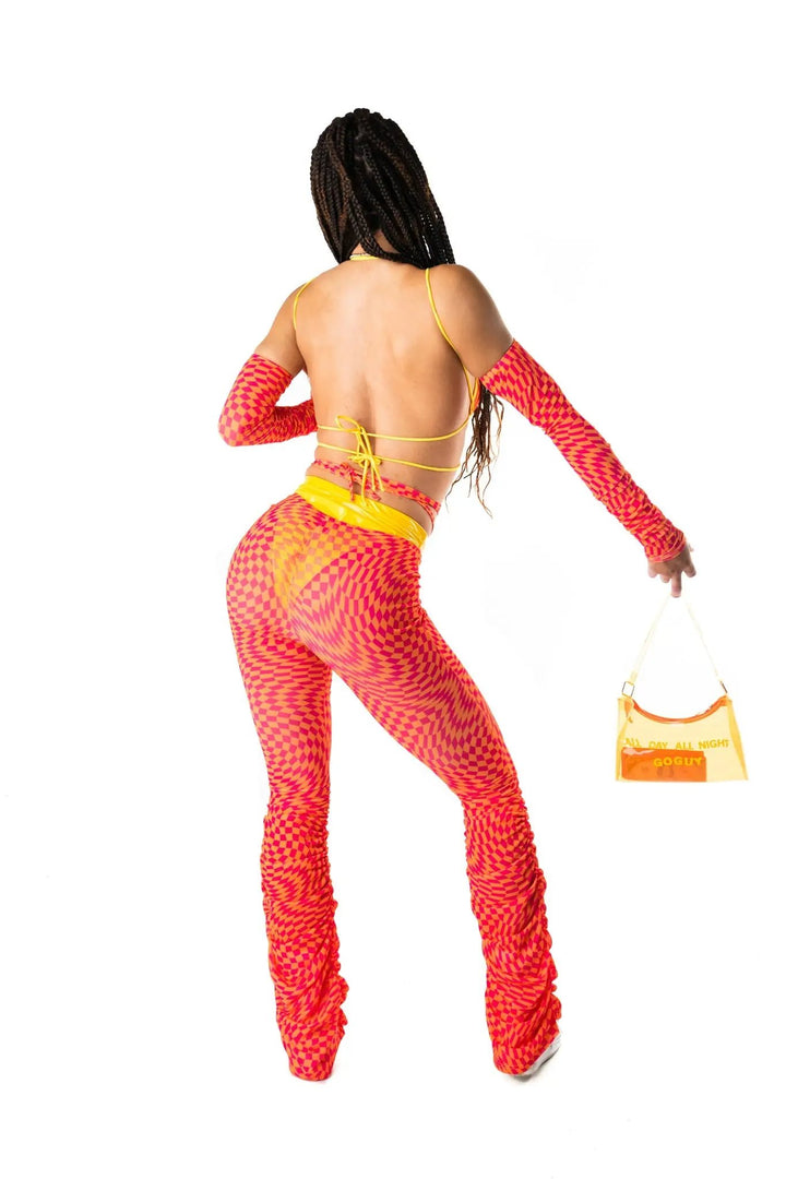 Back view of All Day All Night Gloves styled with sheer checkered pants and yellow strappy top. Perfect for rave and festival outfits.
