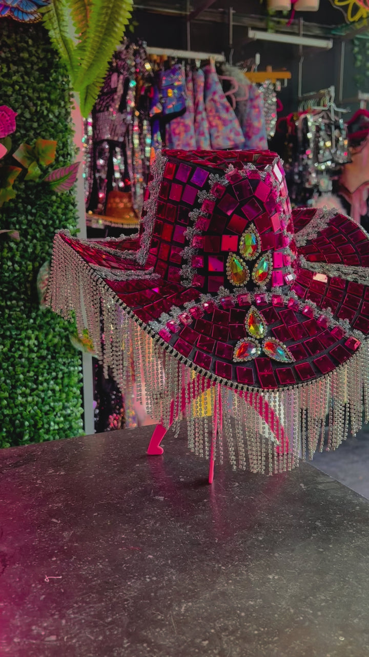 Side angle of Pink Molly Mirror Cowboy Hat with shimmering mirror panels and beaded fringe, ideal for rave and festival clothing collections.