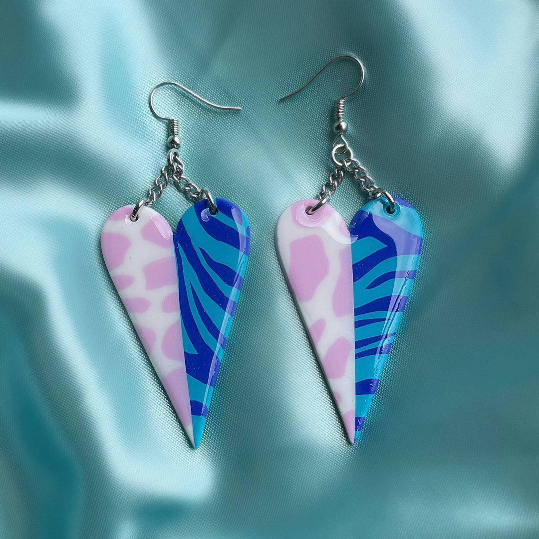 Half & Half Hearts earrings on silky background