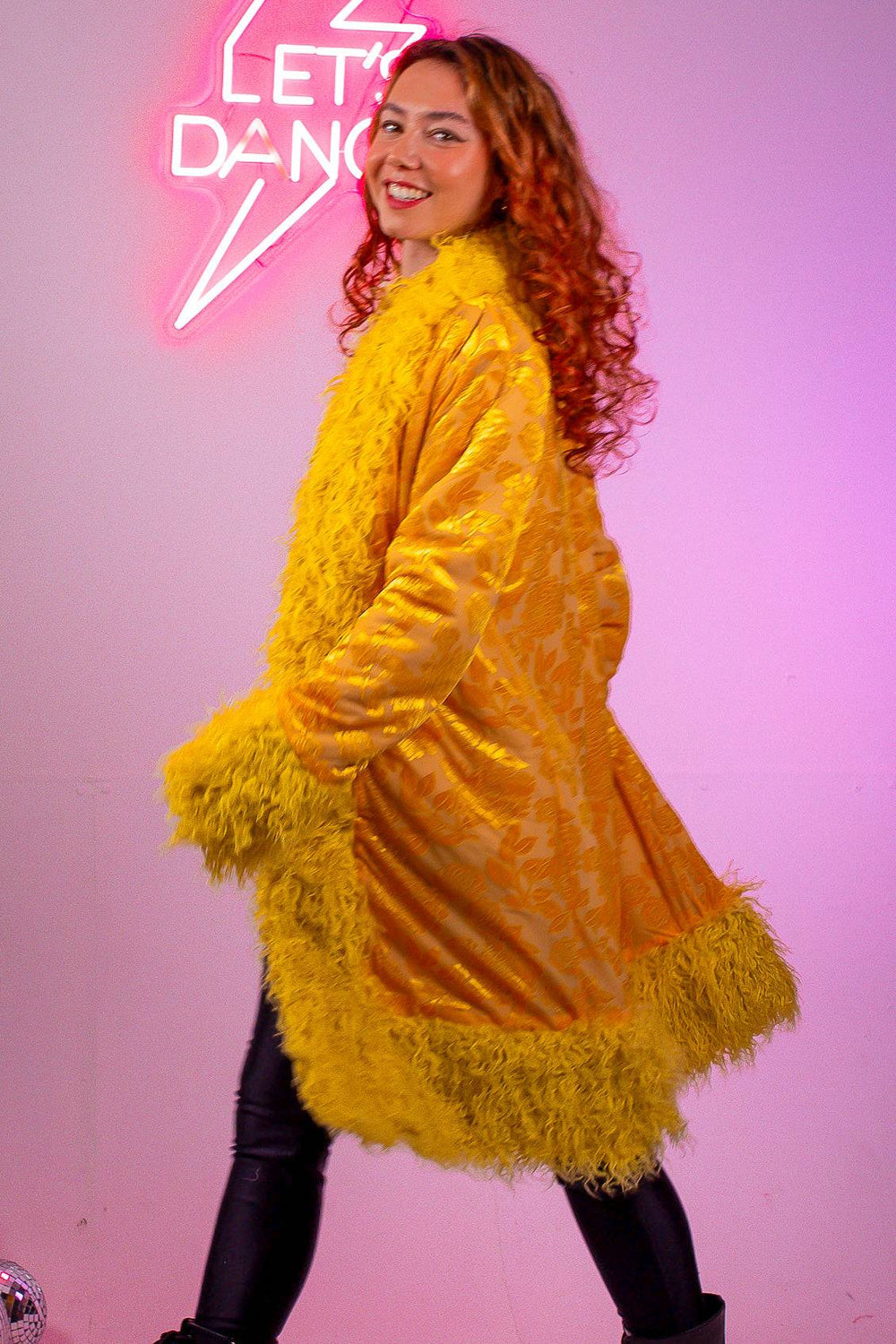 Model wearing Sunflower Lux Faux fur Coat with yellow trim