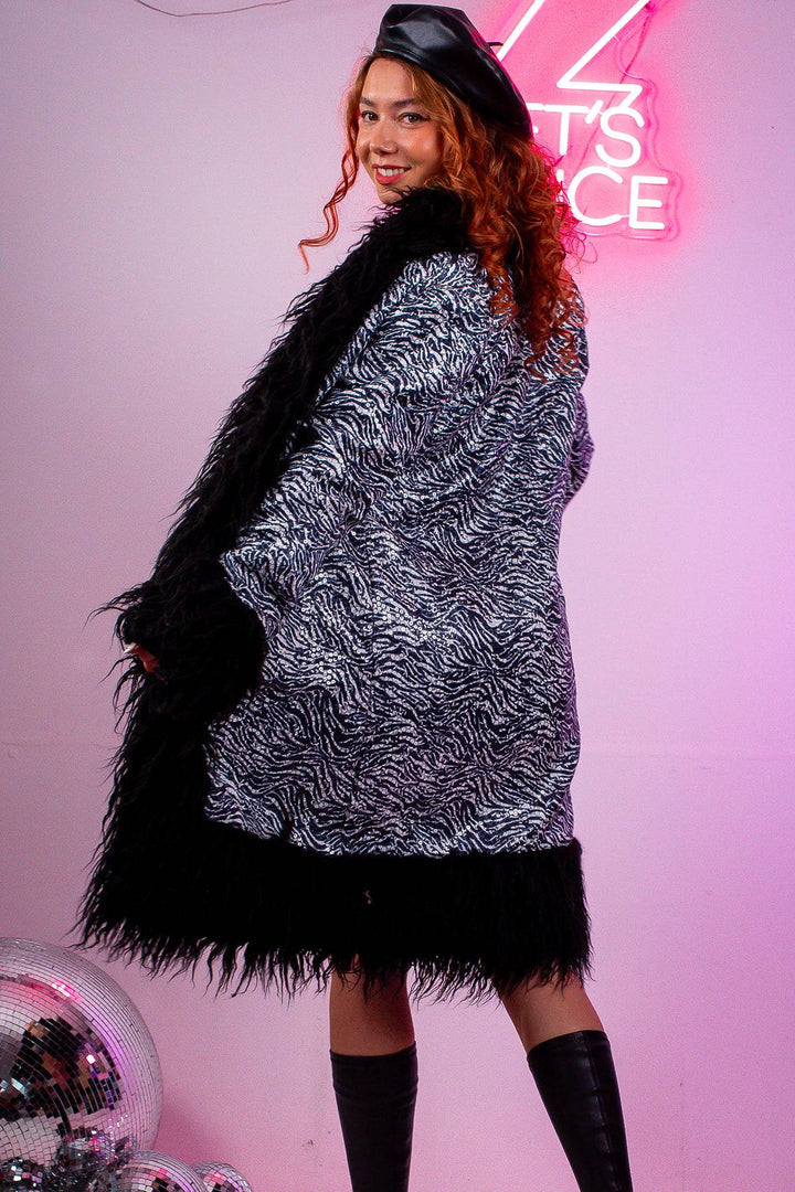 Back view of zebra lux faux fur sequin coat