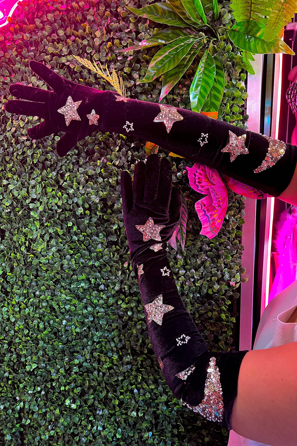 Phase Gloves with glittery stars in a garden setting