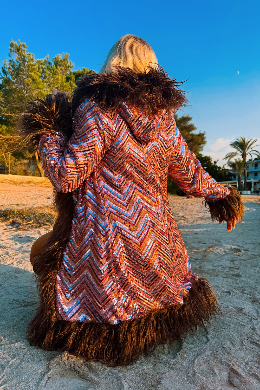 Eden Hooded Sequin Coat on beach, back view