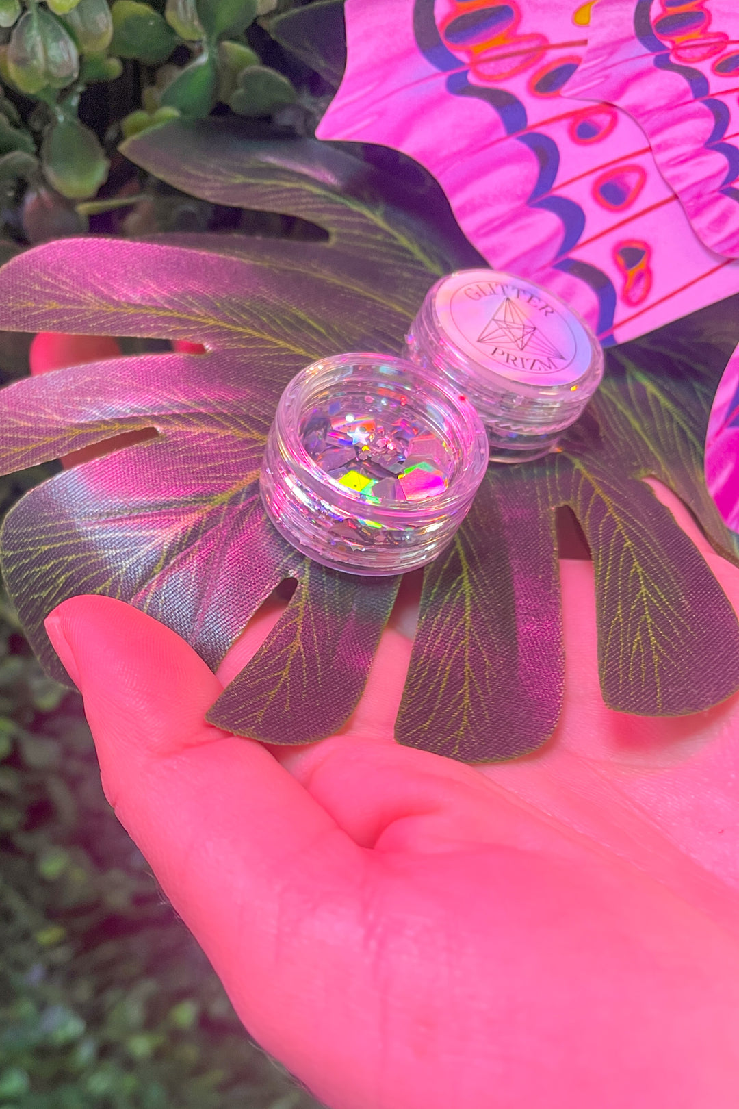 Glitterprizm pot on leaf with colorful background