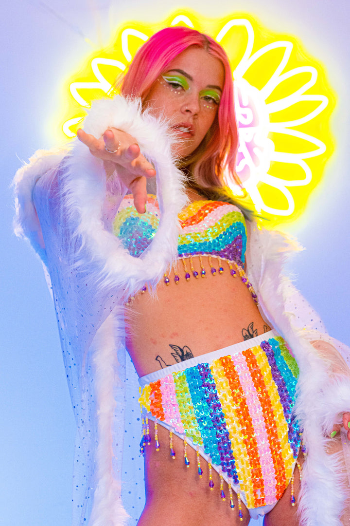 Model in white kimono with rainbow sequin top and bottom