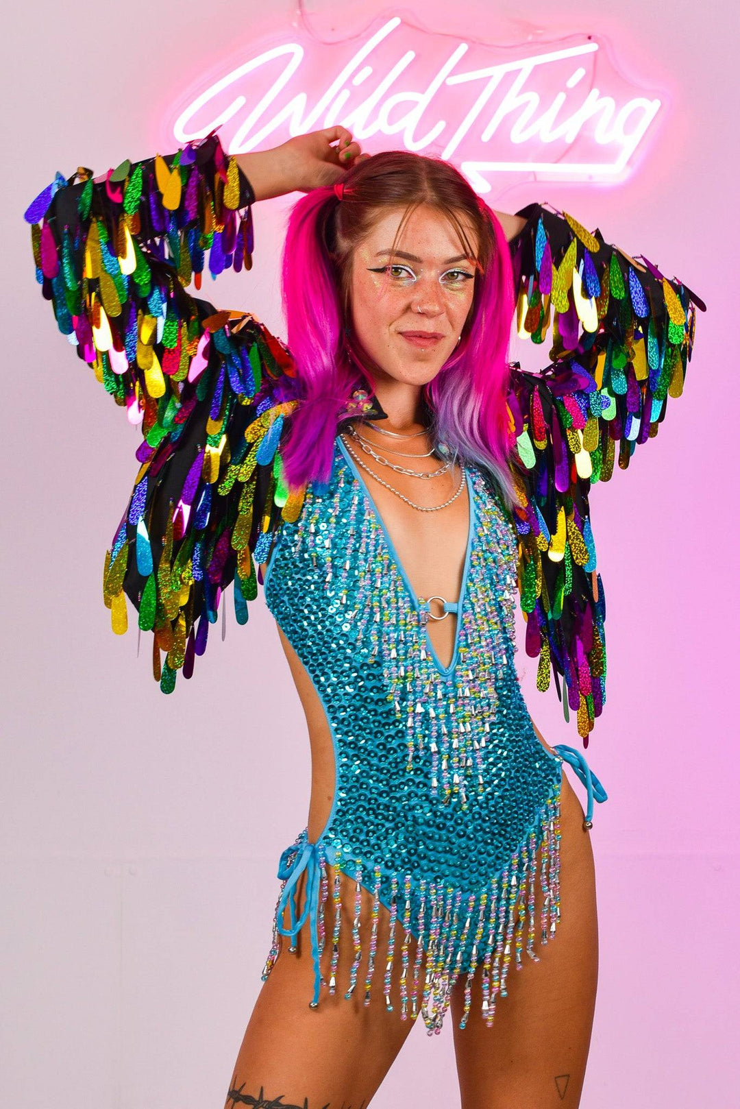 Playful pose in Angel Dust Jacket with rainbow sequins