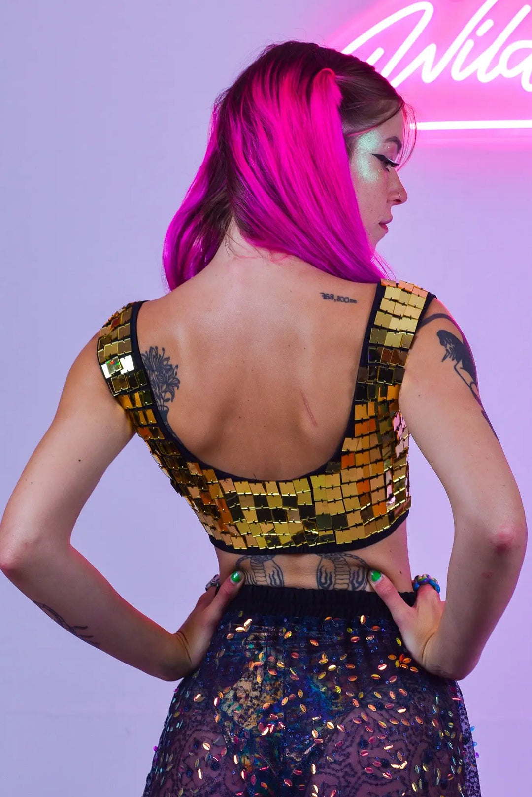 Back view of Gold Molly Mirror Crop Top on model