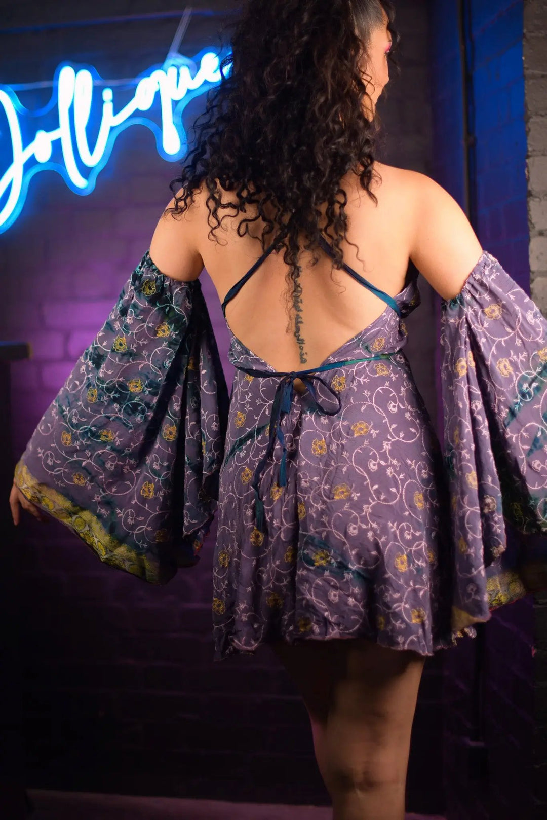 Back view of Celeste Mini Dress with open back design