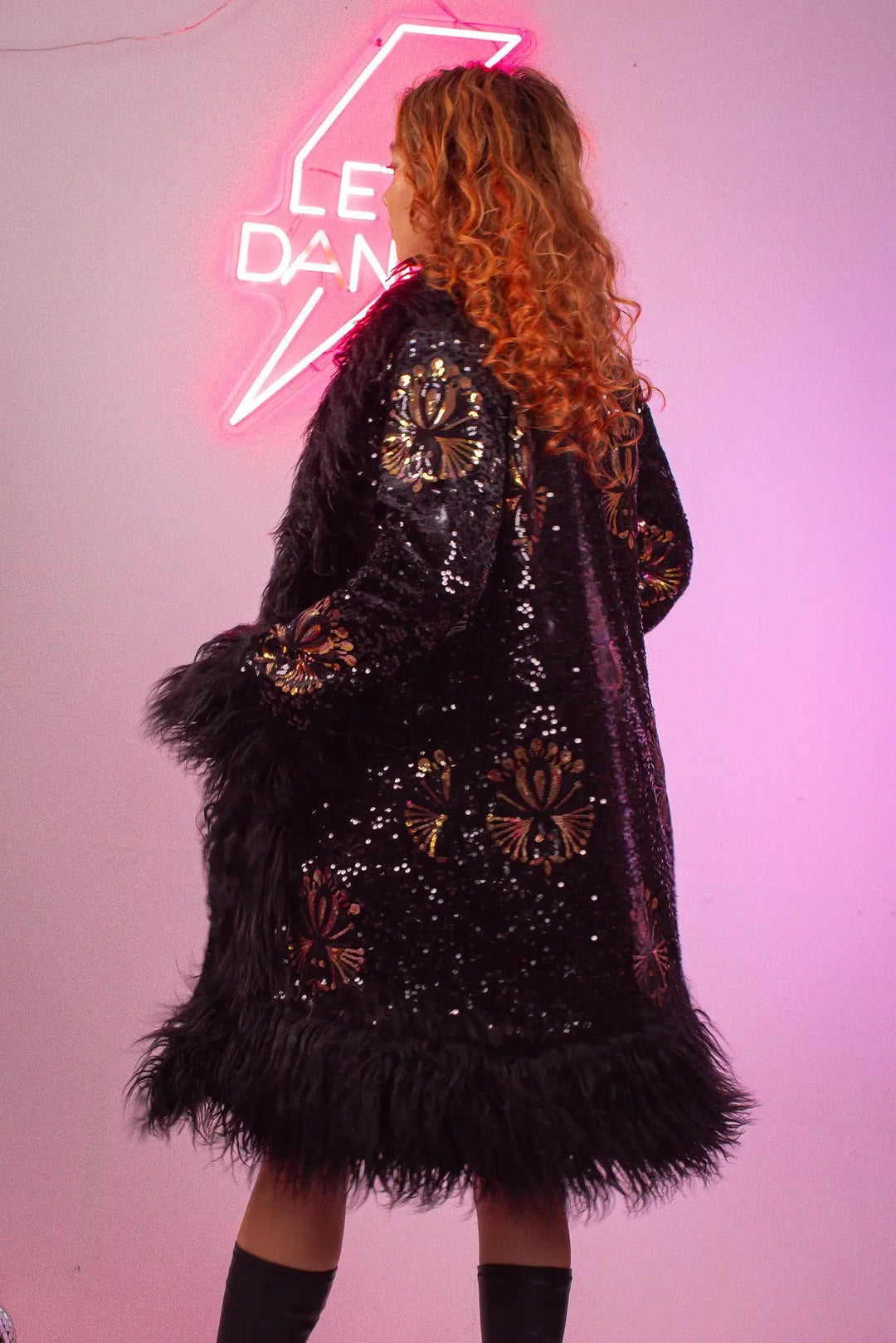 Model turning in Stardust Lux Faux fur Coat with sequins