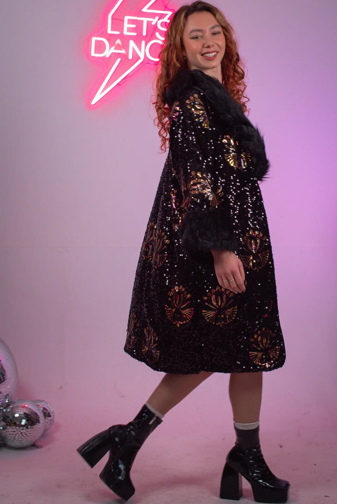 Model twirling in Starlet Jacket Black, disco balls nearby