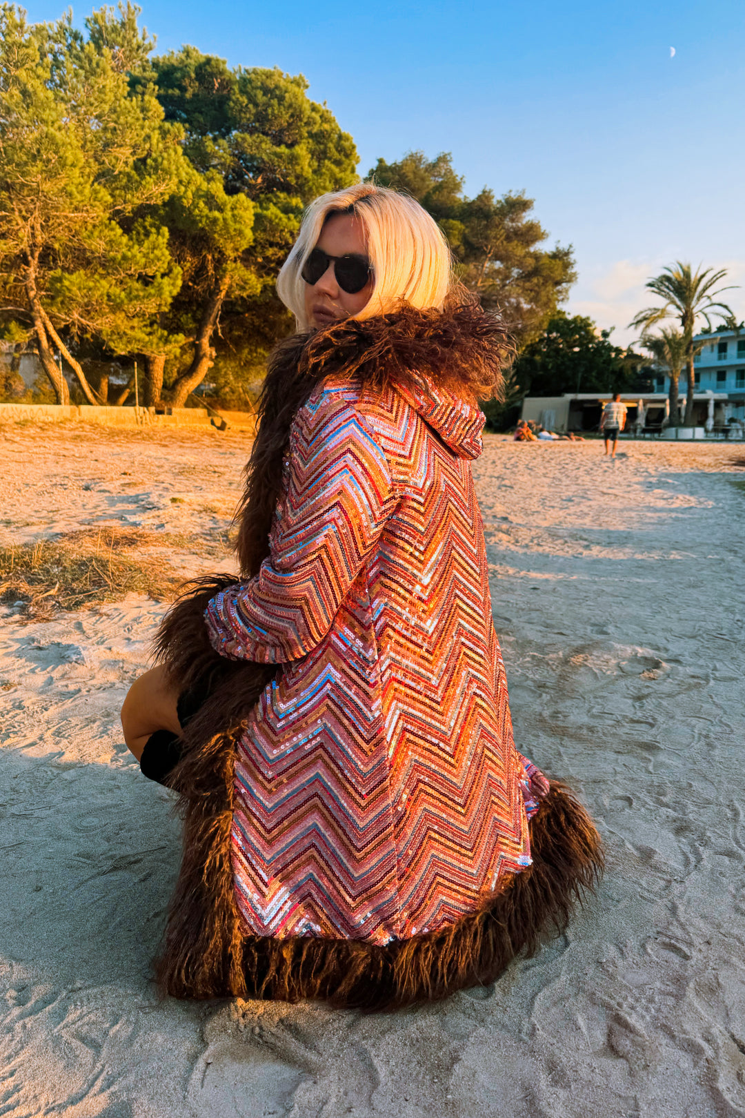 Eden Hooded Sequin Coat on beach, side view