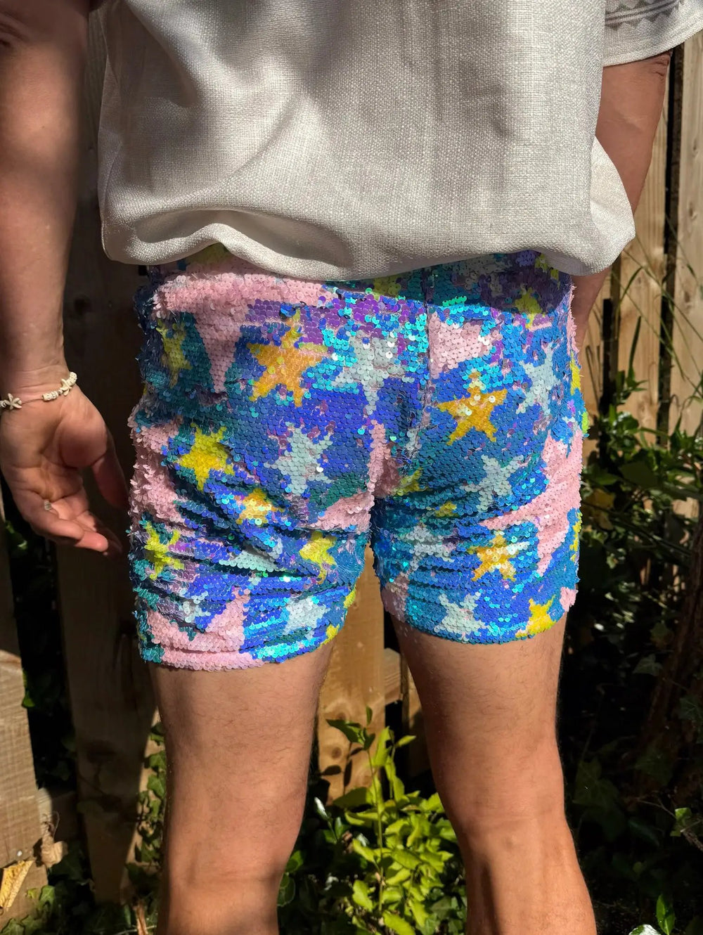 Colorful star-patterned shorts with sequins, back view