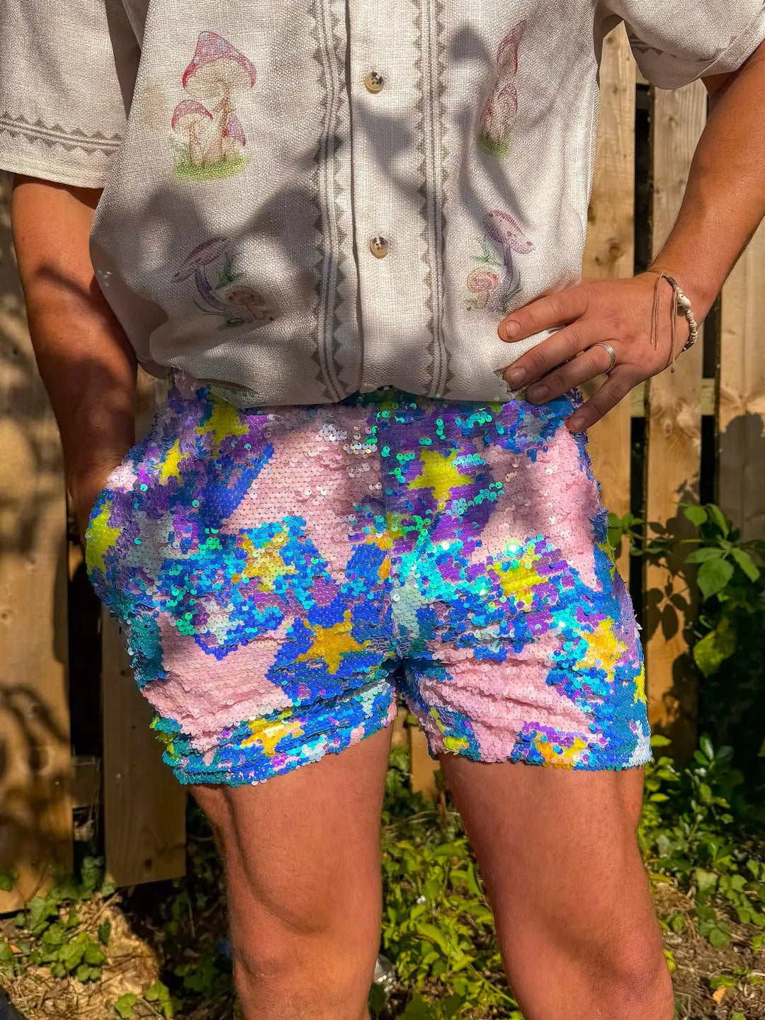 Colorful star-patterned shorts with sequins, front view