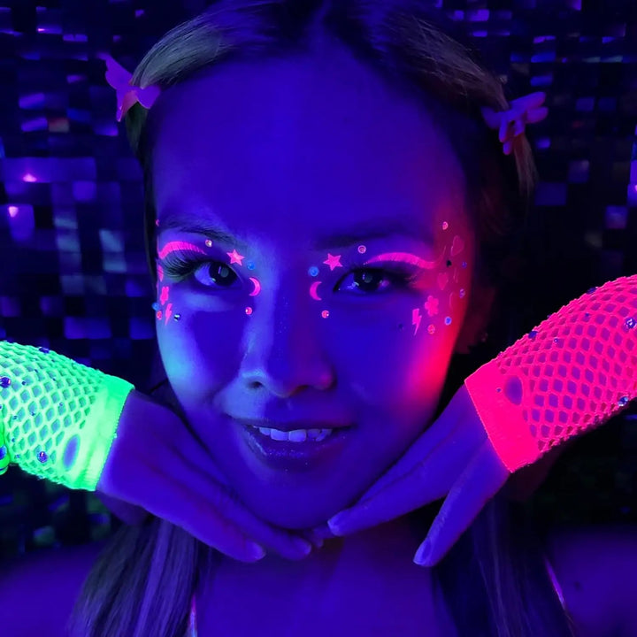 Model glowing with HOLO EYES stickers under UV light