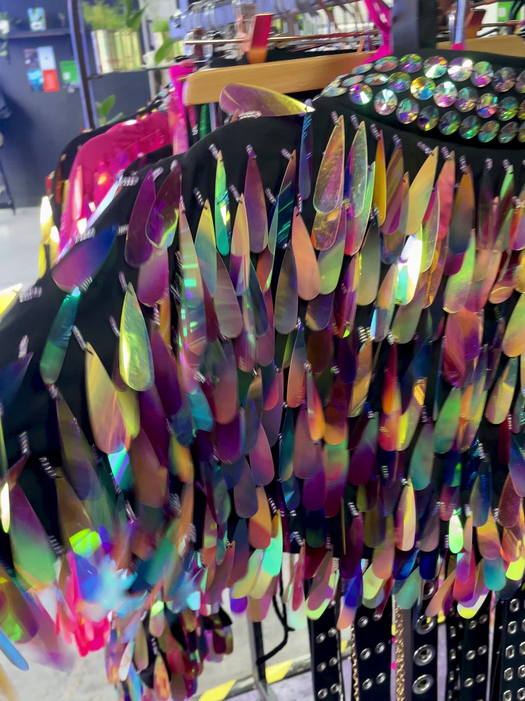 Close-up of iridescent teardrop sequins on jacket