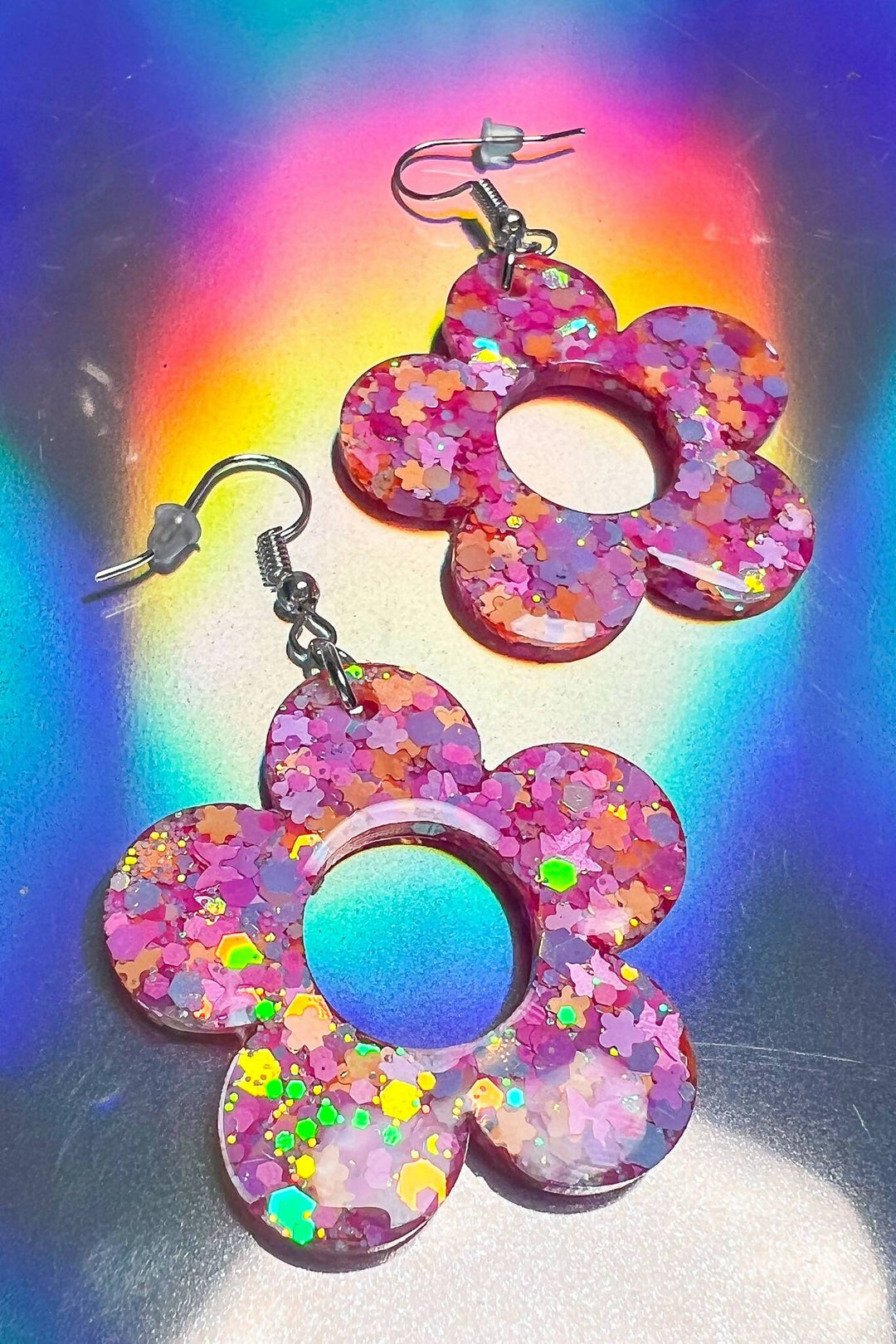 Iridescent floral earrings with rainbow reflection