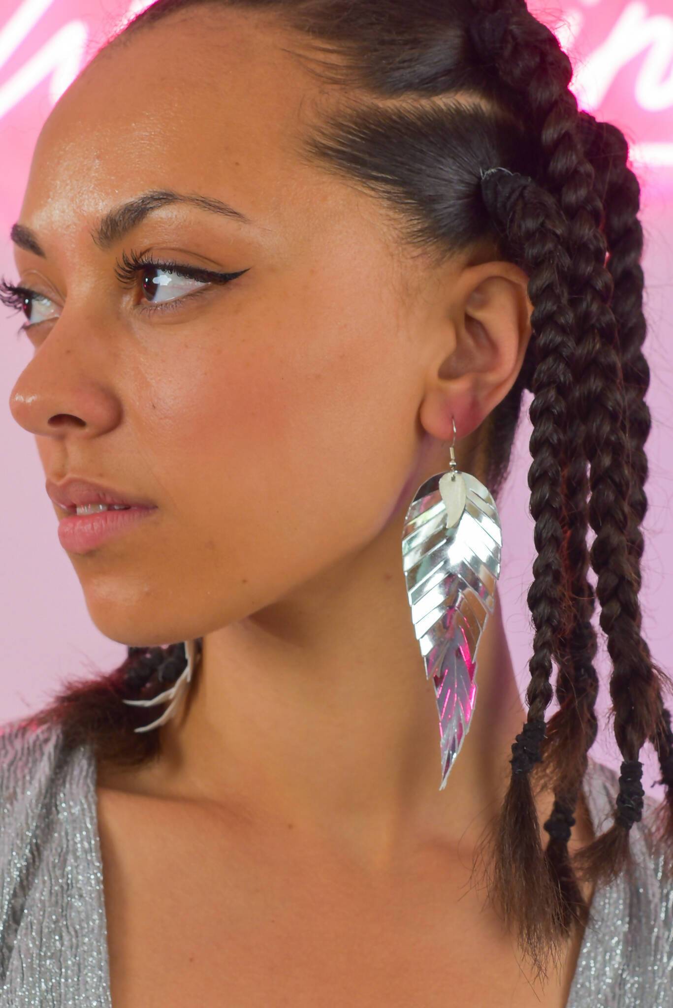 Silver mirrored feathered earrings.