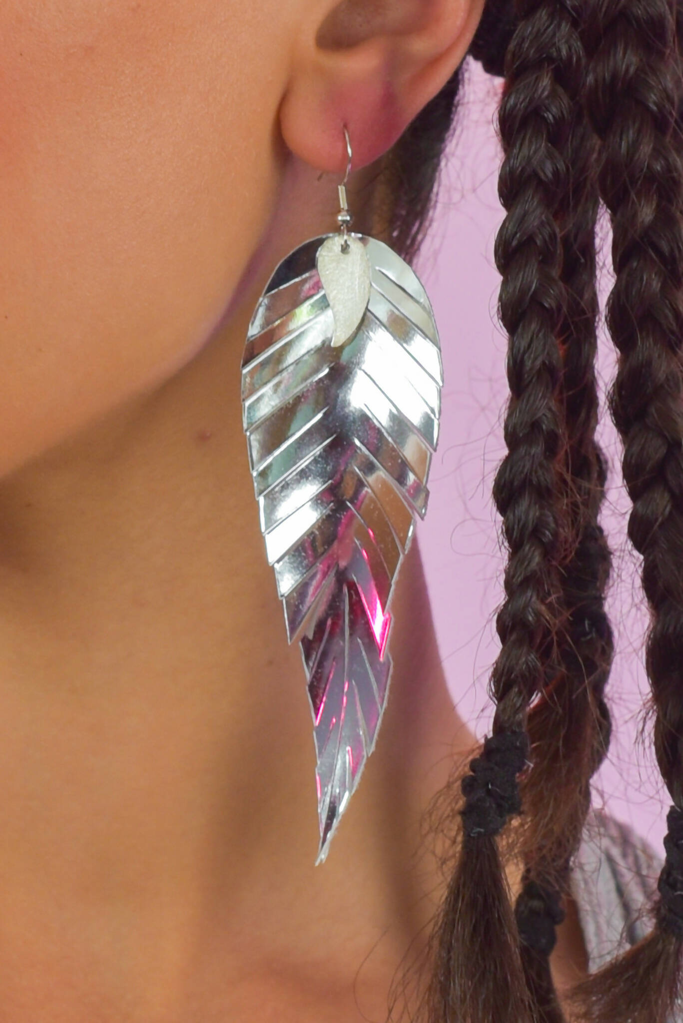 Silver mirrored feathered earrings.