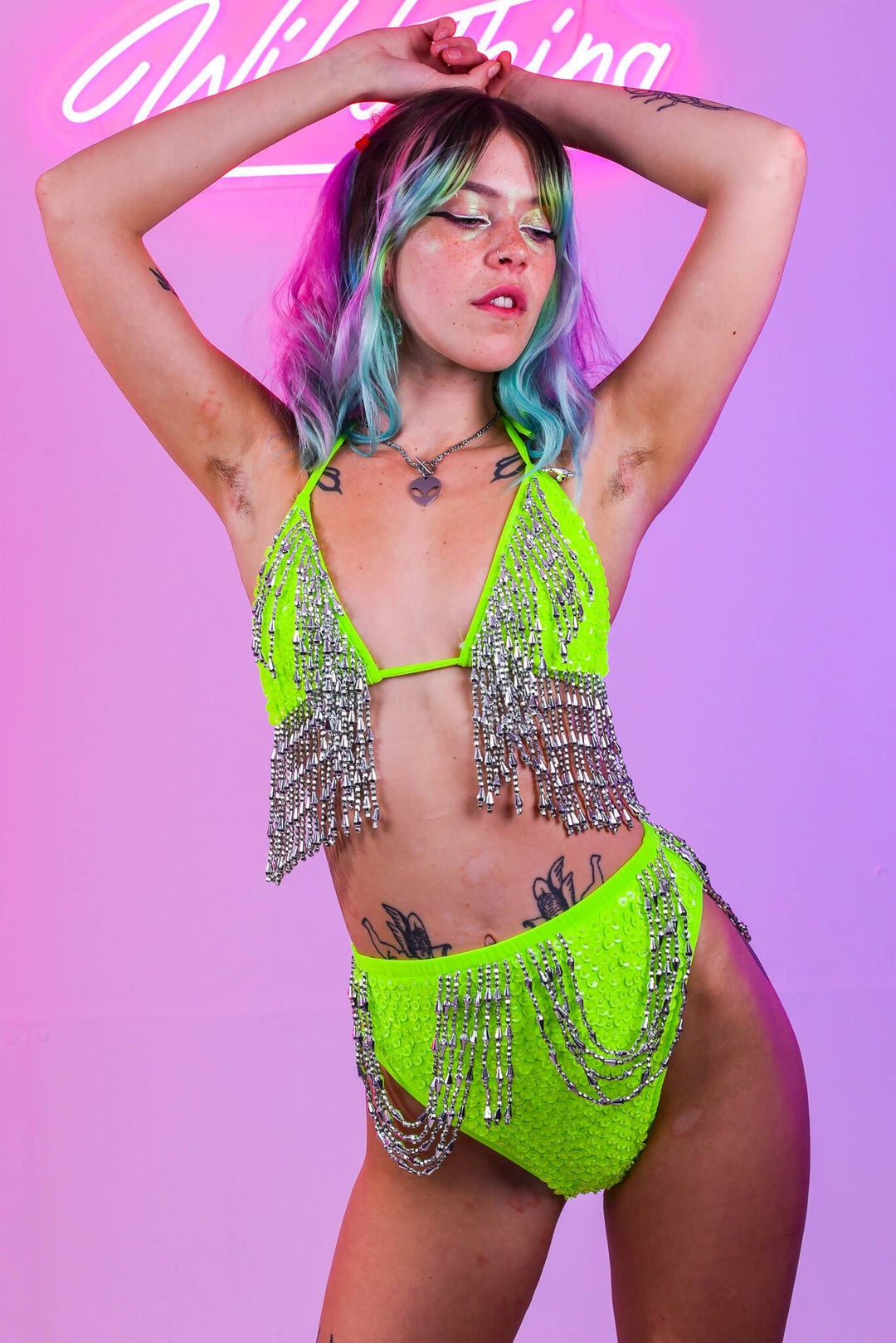 Mandy Neon Green bikini with silver fringe, arms raised