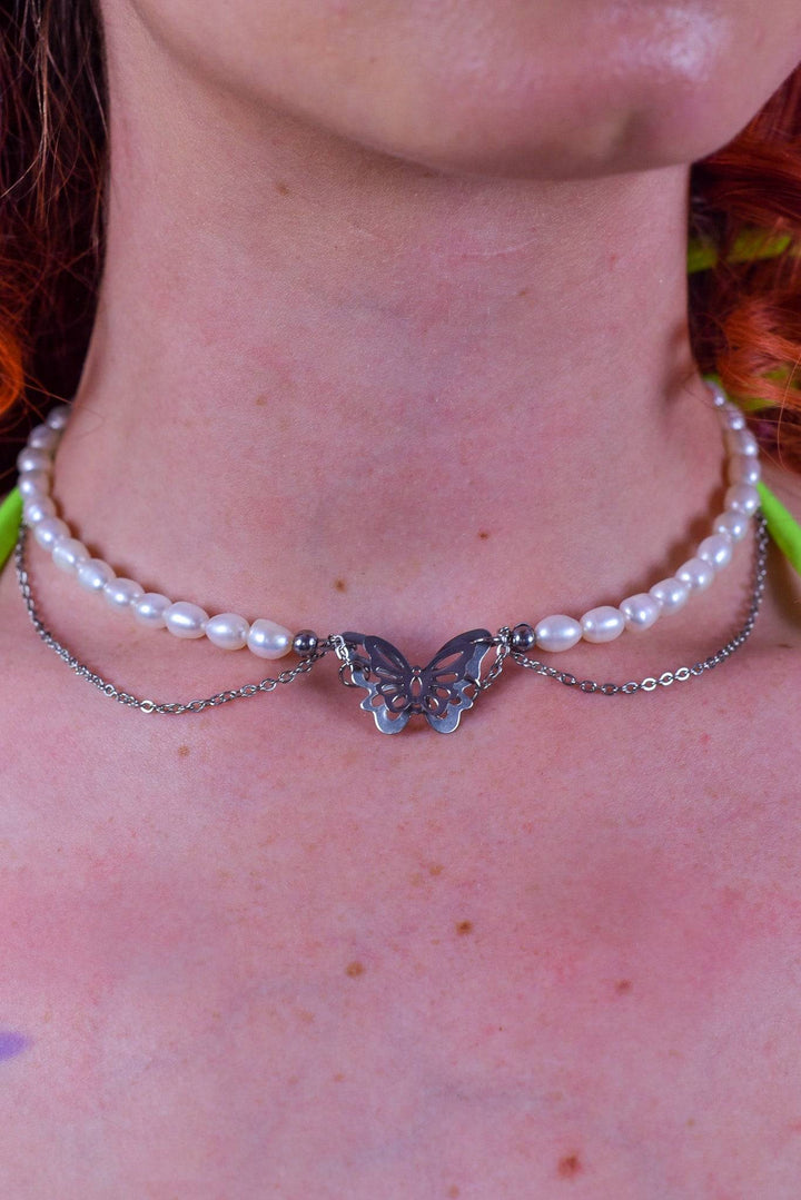 Butterfly pearl necklace with silver chain accents