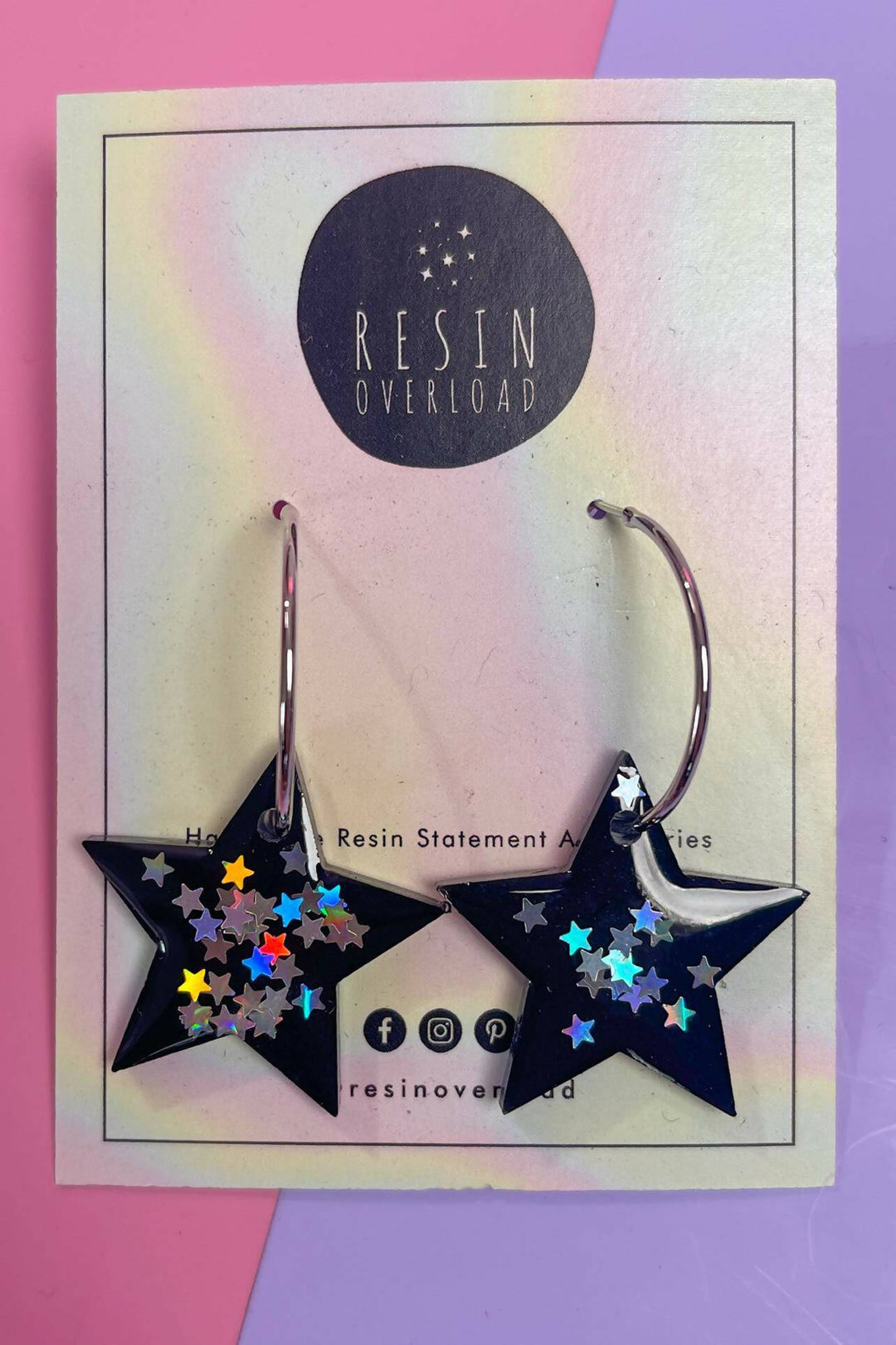 Star shaped silver hoop earrings with glitter stars.