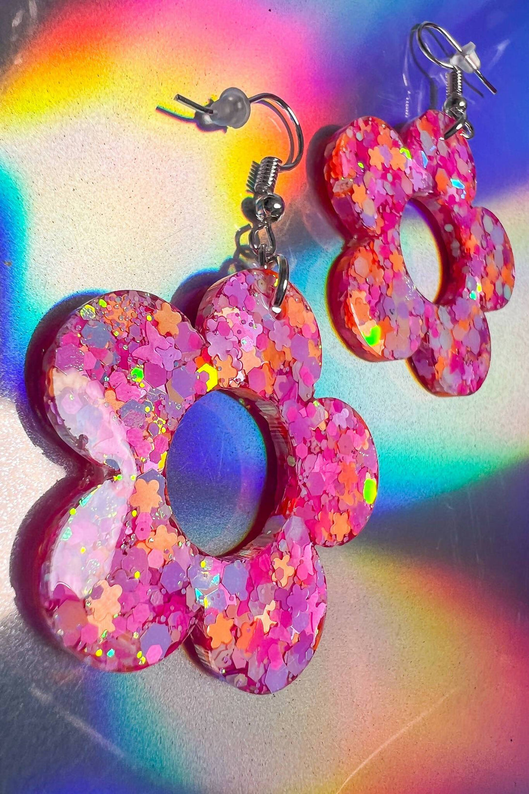 Sparkly flower earrings with colorful iridescence