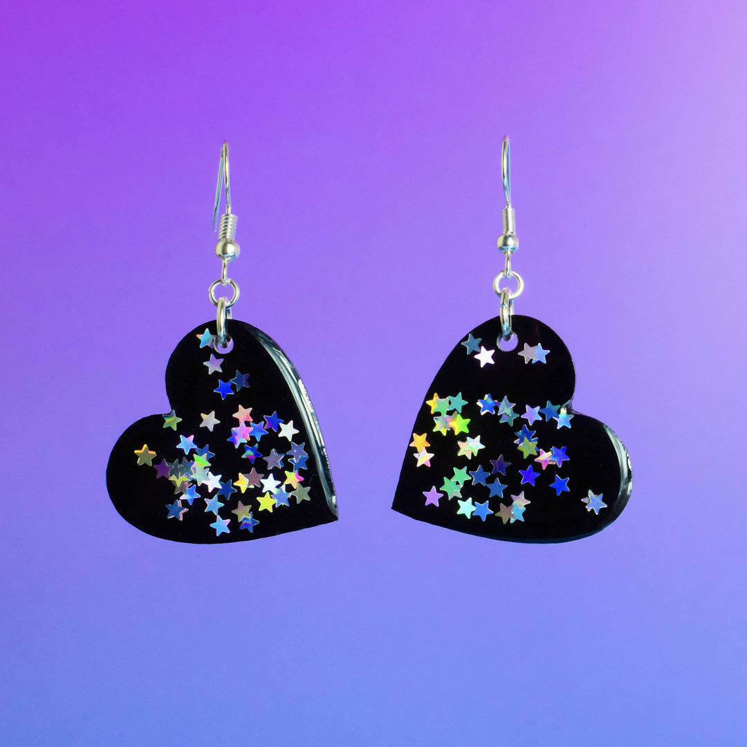 Black heart resin earrings with holographic star accents