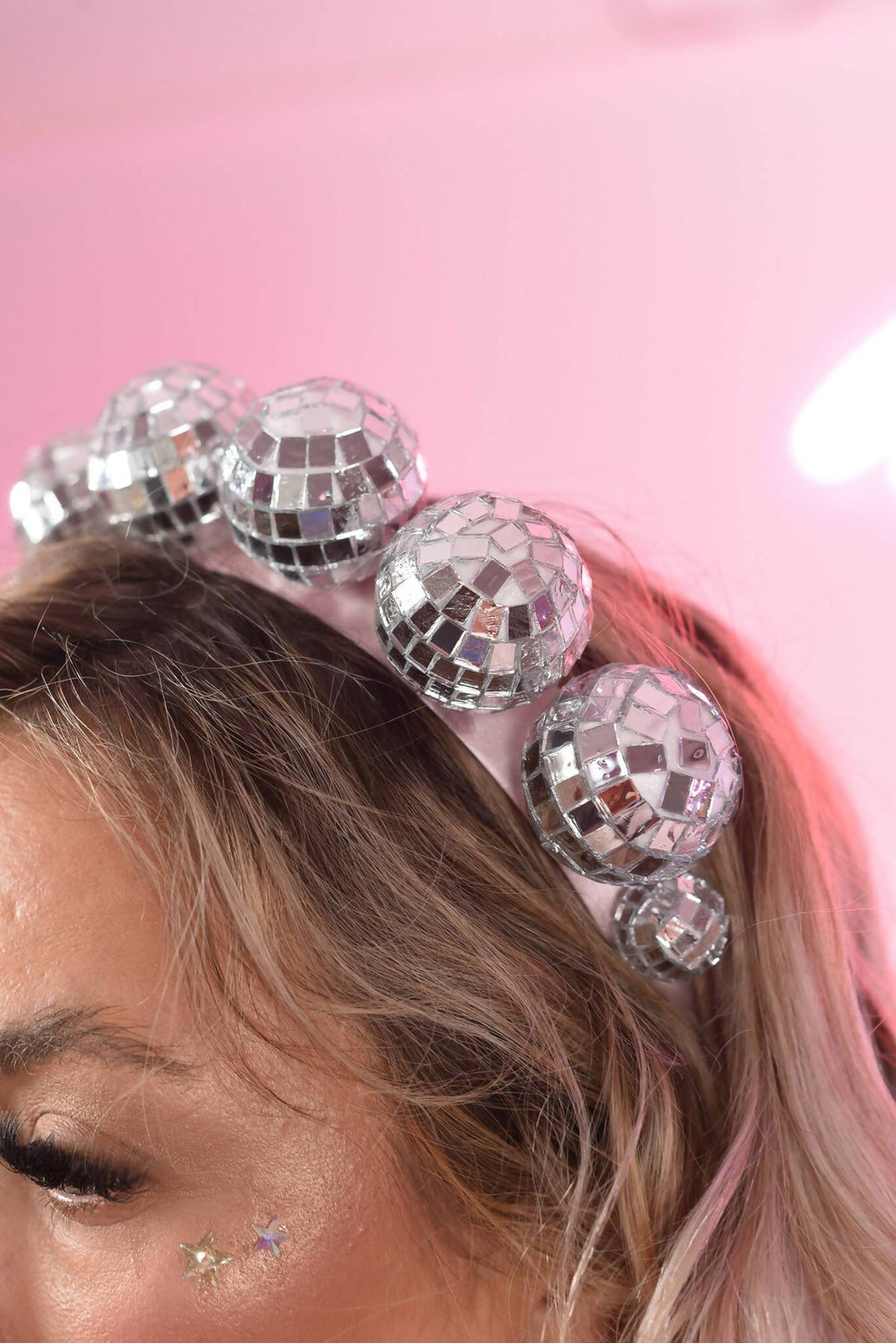 Close-up of reflective disco crown headdress.