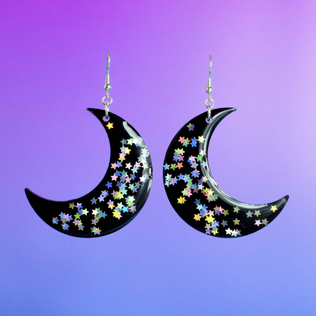 Festival crescent moon earrings with glittery stars.