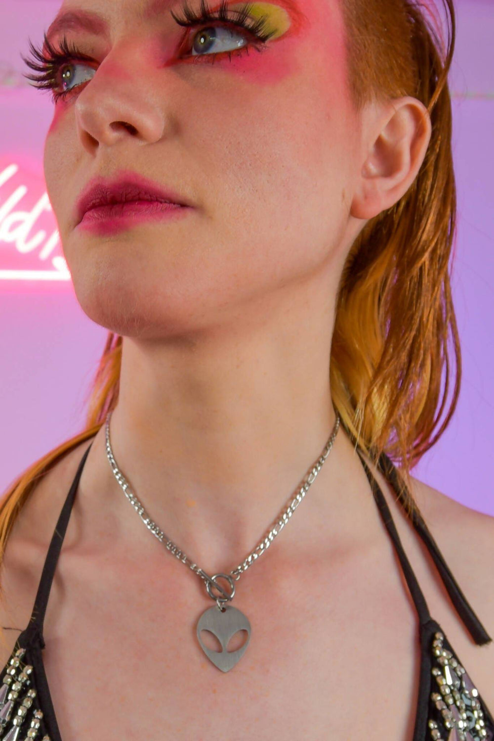 Model wearing alien charm chain necklace