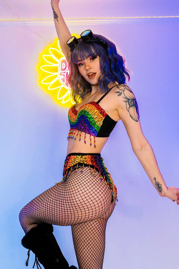 Model posing in Rainbow Bright Set with sequin details and goggles.