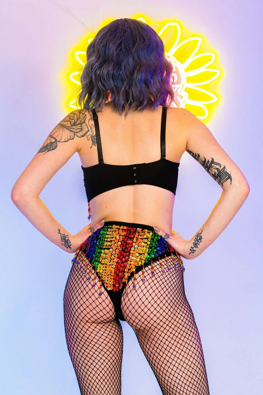 Back view of Rainbow Bright Set with rainbow sequins and fishnet tights.