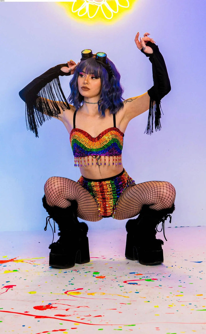 Model in Rainbow Bright Set with fringe sleeves and platform boots.