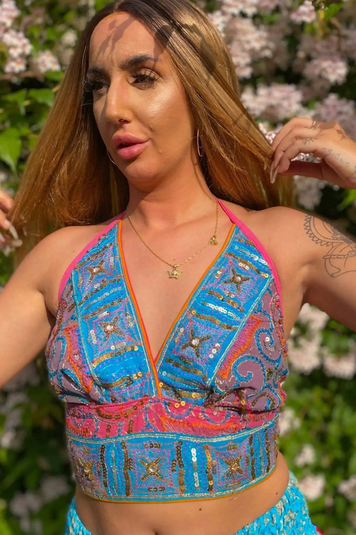 Sophia Dollique Top in vibrant blue and pink with sequin details.