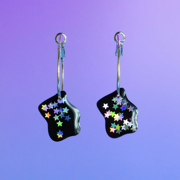 Organic shaped resin earrings with holographic stars on purple