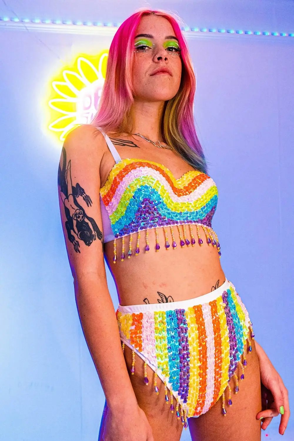 Rainbow sequin festival set with fringe details.