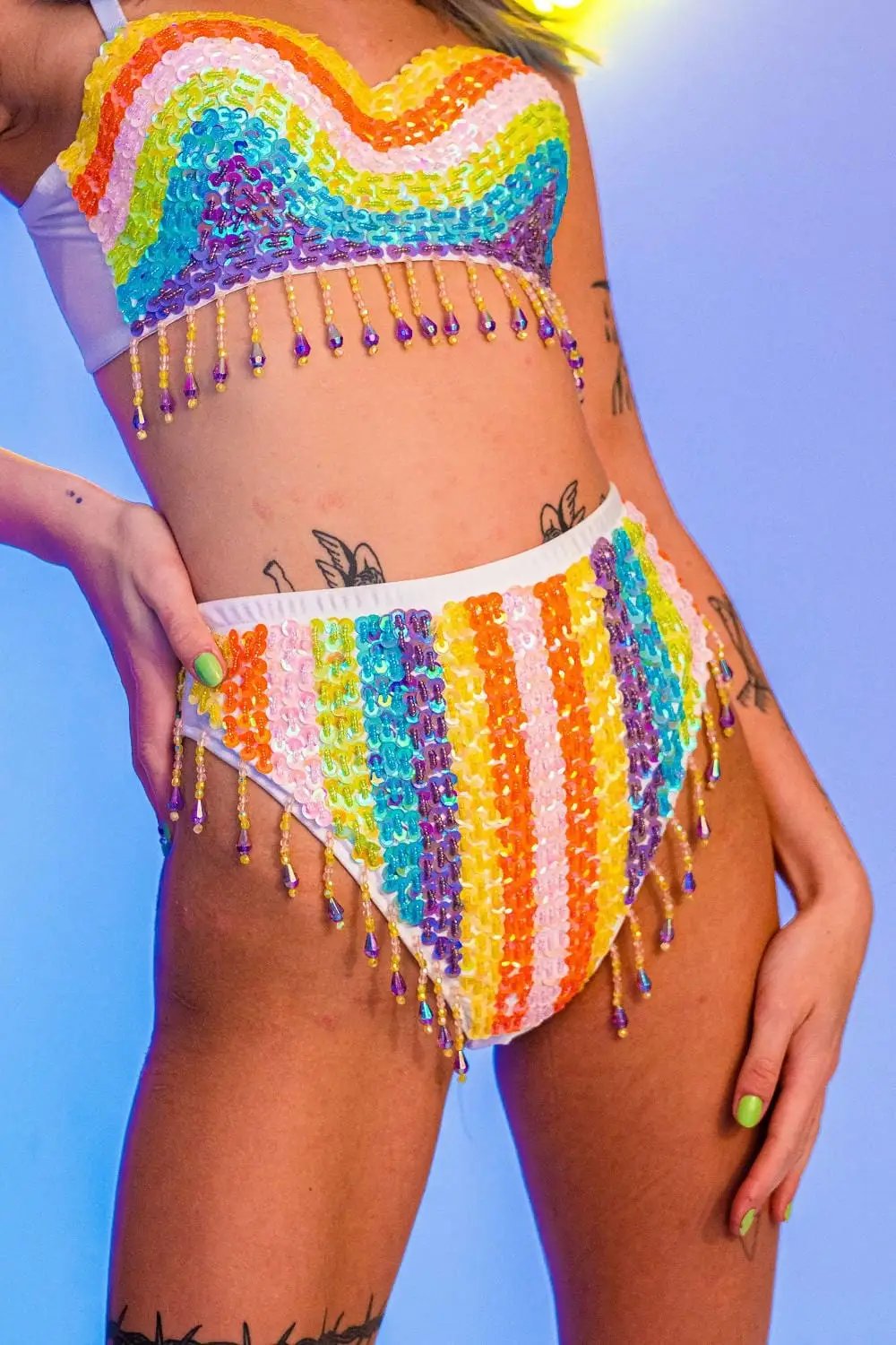 Rainbow sequin high-waisted shorts with fringe.