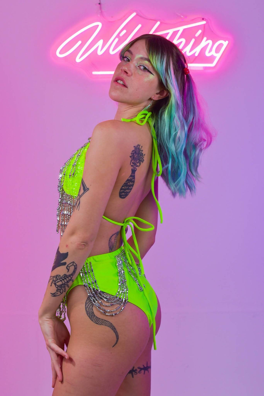 Side view of Mandy Neon Green bikini with silver details